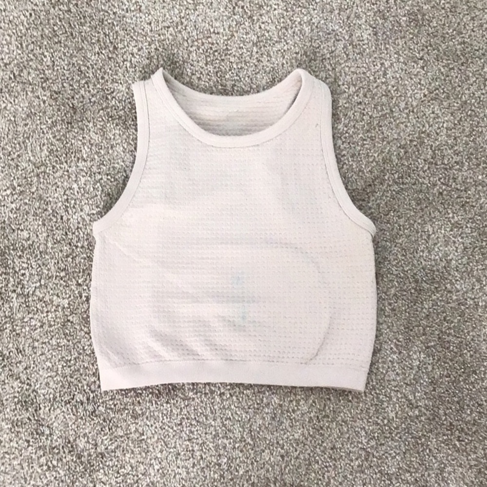 Tan crop top with small stain from blue face paint